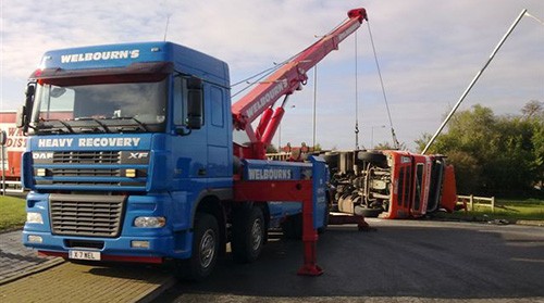 Welbourn's DAF heavy recovery truck lifting an overturned lorry