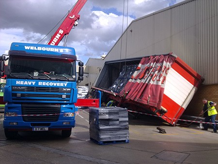 Welbourn's heavy recovery truck lifting a container body