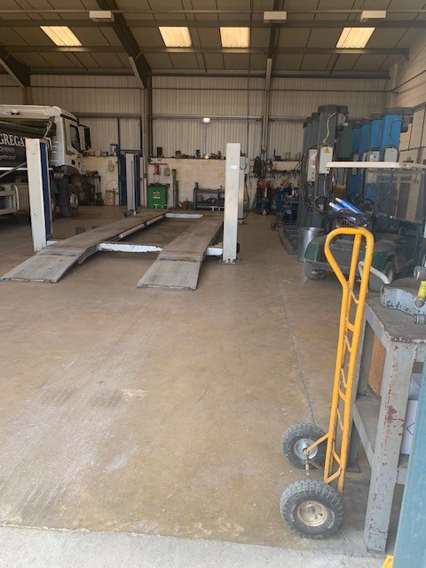 Vehicle lift and ramps in the Welbourn's workshop at Wisbech
